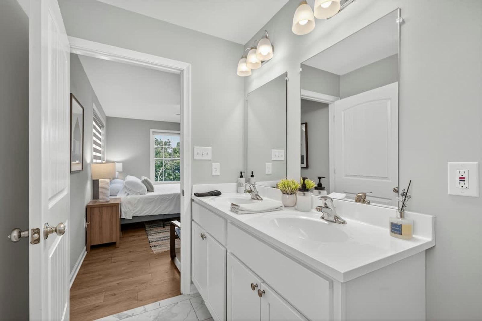 Ensuite bathroom with a double vanity and natural light