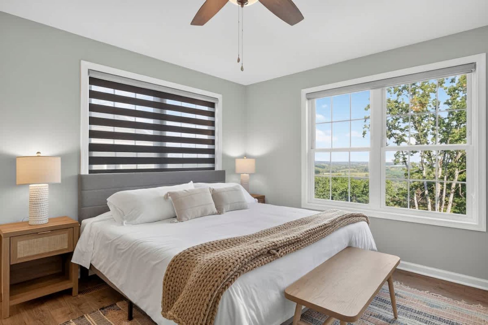 King bedroom with a valley view through oversized windows