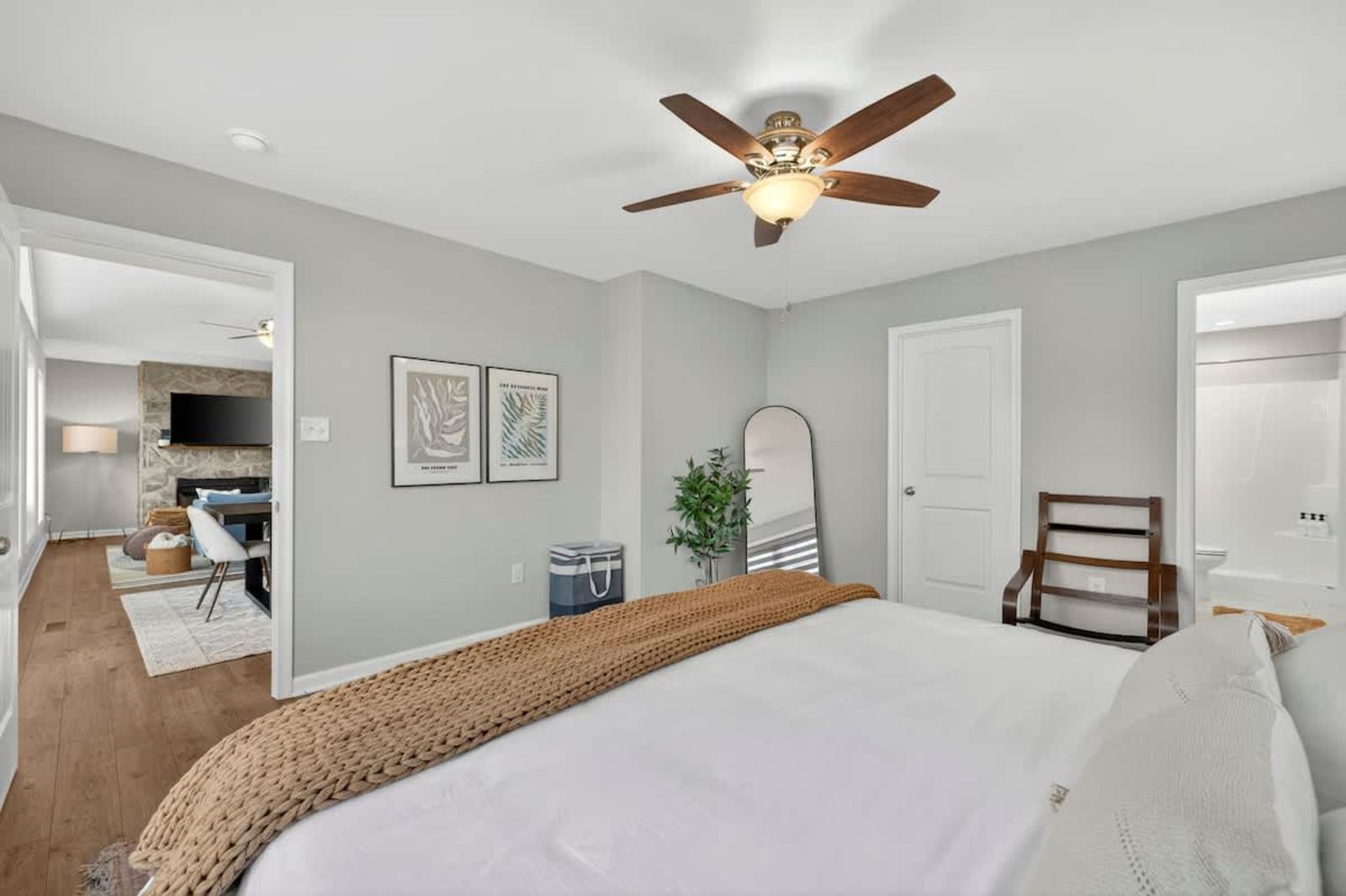 King primary bedroom with a sitting area and ensuite bathroom