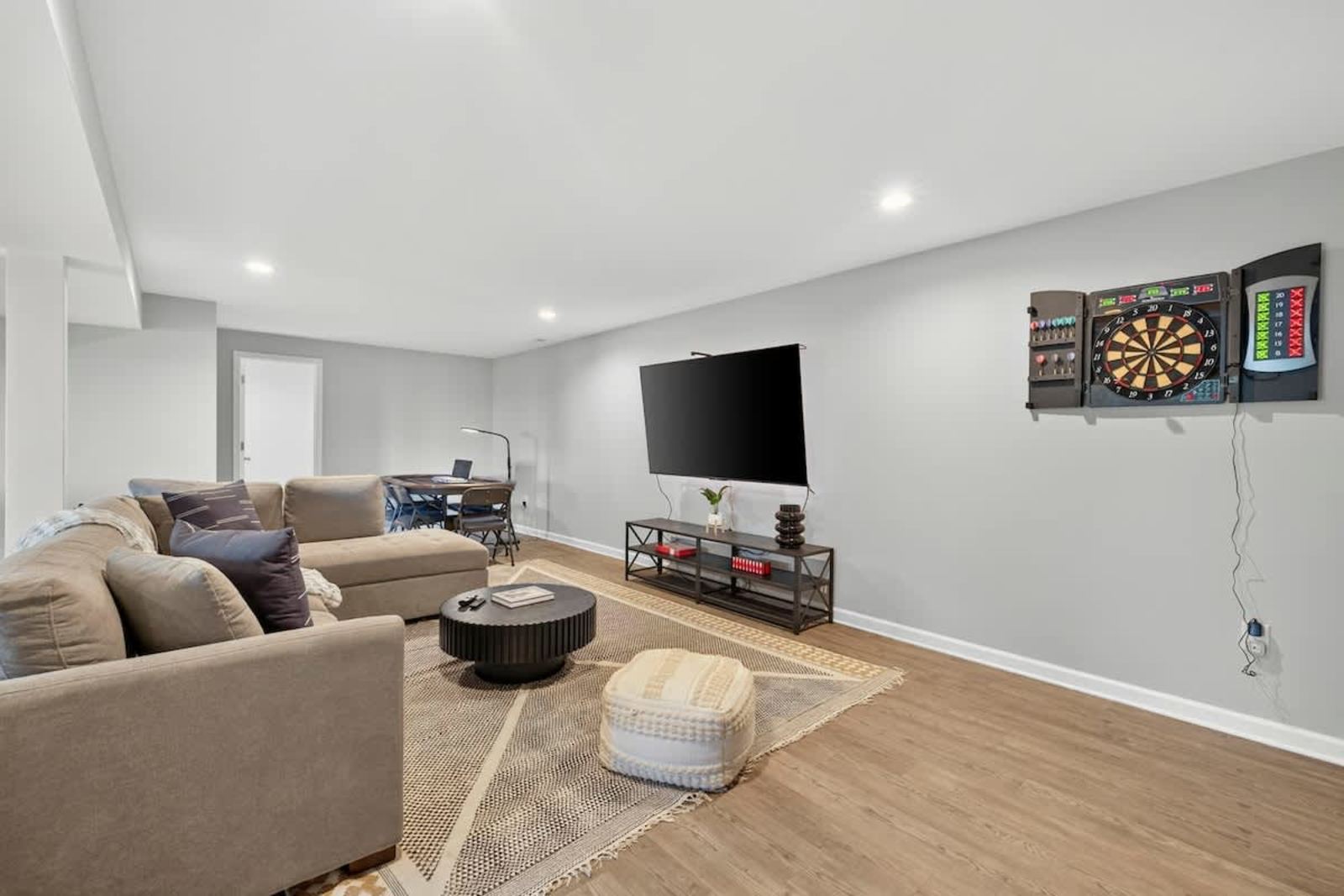 Rec room with an electronic dartboard and TV lounge